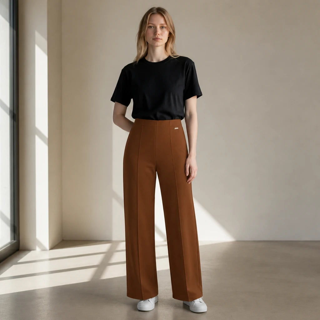 duwies high-waisted tobacco brown wide-leg tailored trousers worn by a woman with a black t-shirt and white sneakers